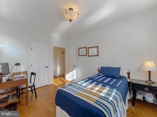 bedroom with light wood-type flooring