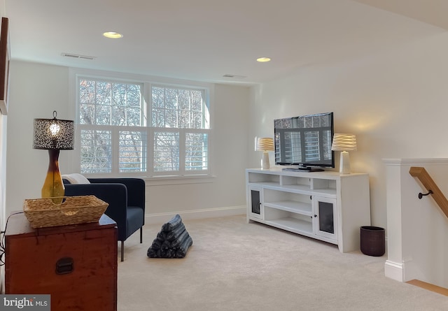 sitting room with carpet floors