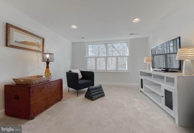 living area with light carpet