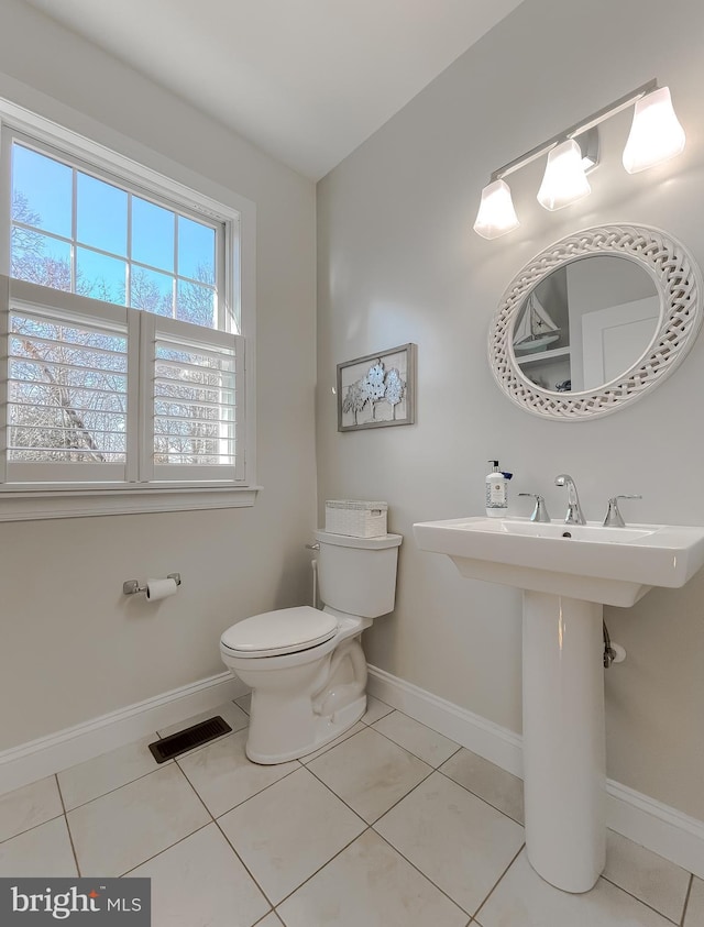 bathroom featuring tile patterned floors and toilet