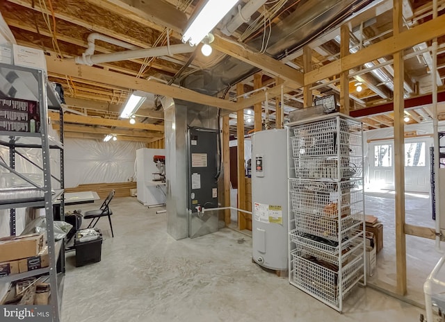 basement with white fridge and water heater