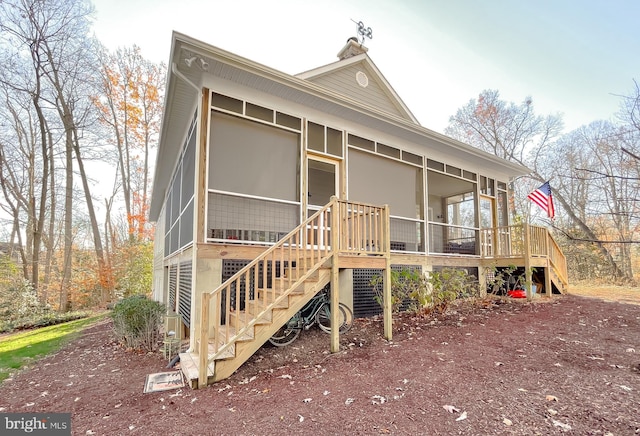 view of front facade featuring a sunroom