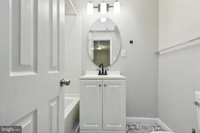 bathroom featuring a bathing tub, tile patterned flooring, and vanity