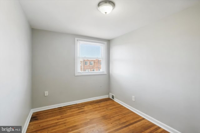 empty room featuring hardwood / wood-style floors