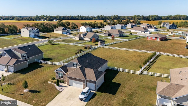 birds eye view of property with a rural view