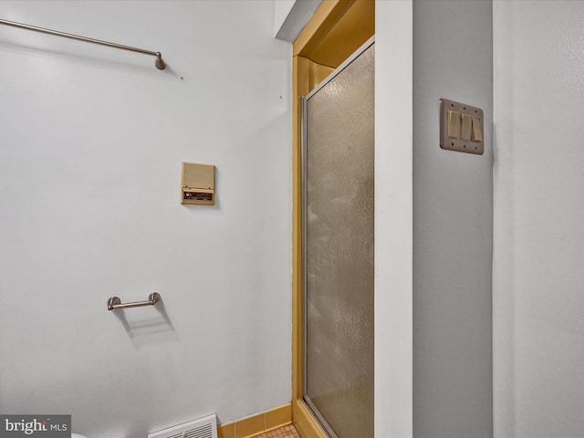 bathroom featuring walk in shower