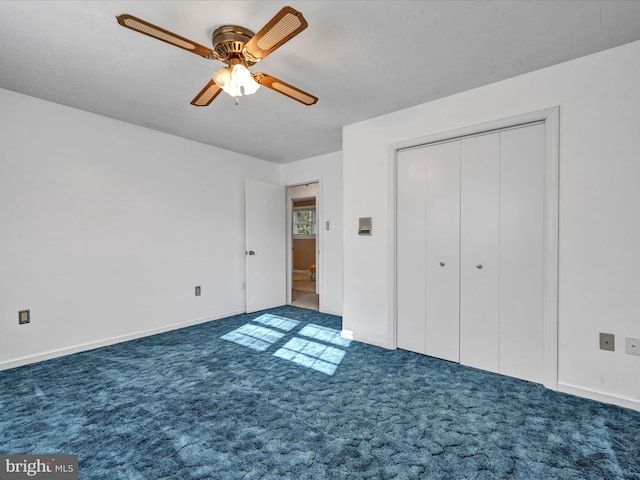 unfurnished bedroom with a closet, ceiling fan, and dark colored carpet