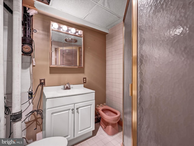 bathroom featuring vanity, a bidet, toilet, and tile patterned floors