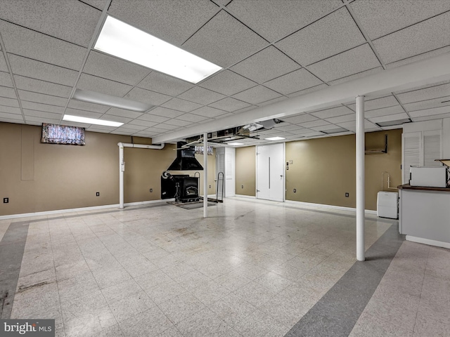 basement featuring a paneled ceiling