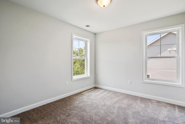 unfurnished room with carpet flooring