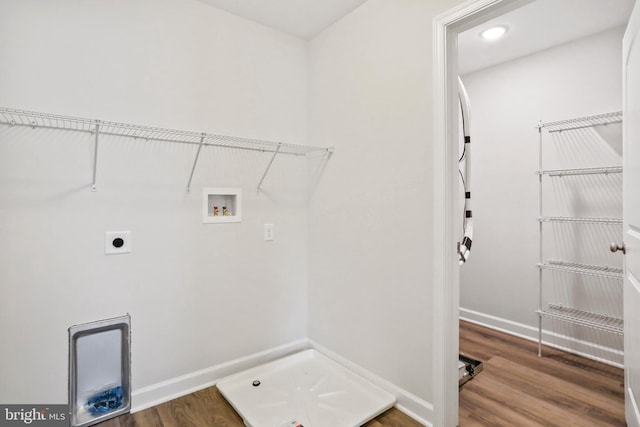 washroom featuring electric dryer hookup, wood-type flooring, and washer hookup