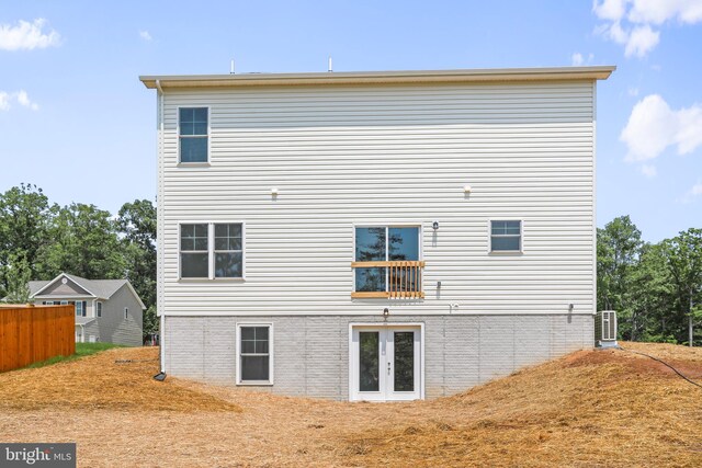 rear view of property with french doors