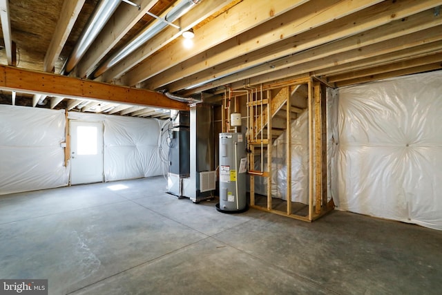 basement featuring water heater and heating unit