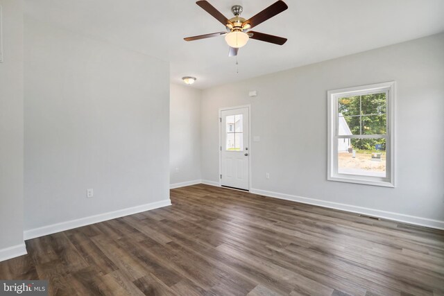 interior space featuring ceiling fan and dark hardwood / wood-style floors