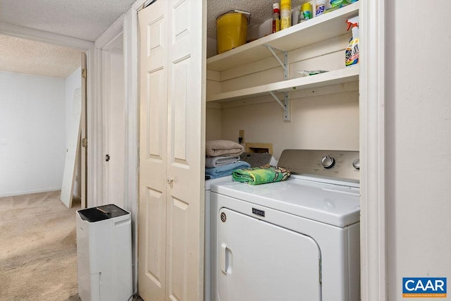 clothes washing area with separate washer and dryer, a textured ceiling, and light colored carpet