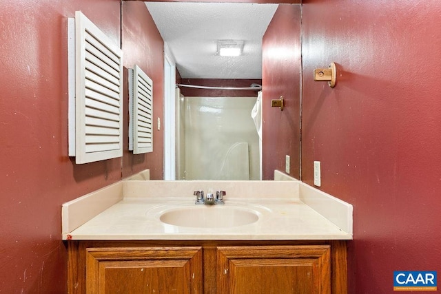 bathroom featuring vanity and a textured ceiling