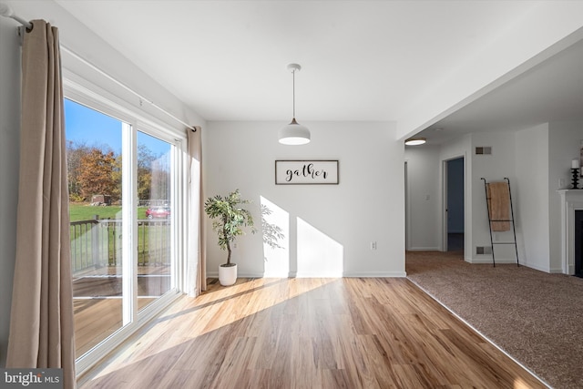 unfurnished dining area with hardwood / wood-style flooring