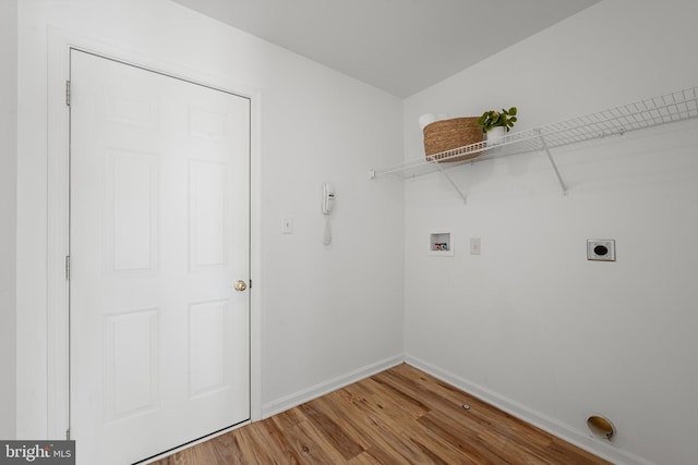 laundry area featuring hookup for an electric dryer, hookup for a washing machine, and hardwood / wood-style flooring