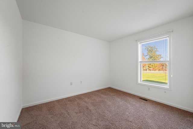 empty room featuring carpet flooring