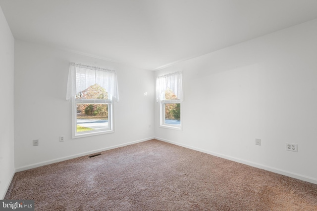 empty room featuring carpet flooring