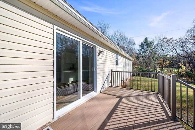 wooden deck with a yard