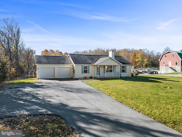 single story home with a front yard, a porch, and a garage