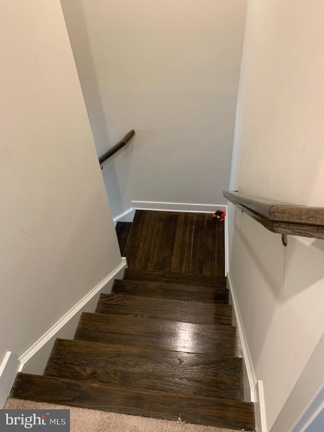 staircase featuring hardwood / wood-style floors