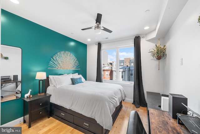 bedroom featuring light hardwood / wood-style flooring and ceiling fan