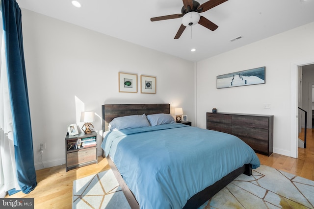 bedroom featuring ceiling fan and light hardwood / wood-style flooring