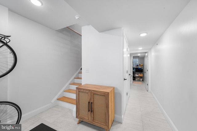 hallway with light tile patterned floors