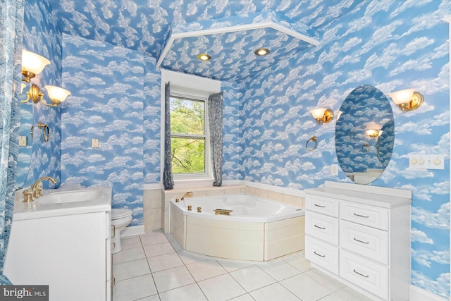 bathroom featuring toilet, vanity, wallpapered walls, tile patterned flooring, and a garden tub