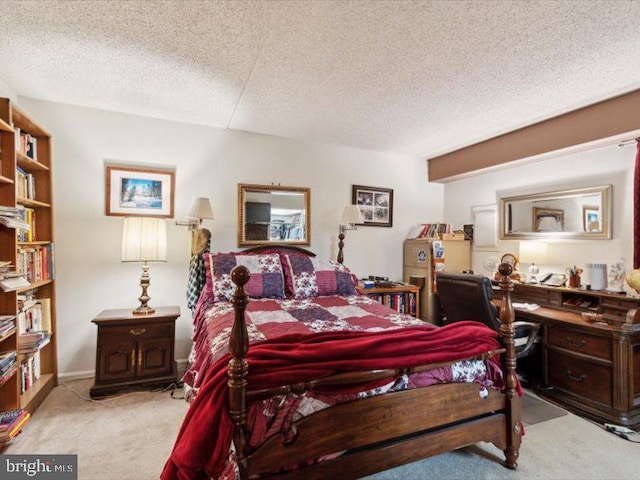 carpeted bedroom with a textured ceiling