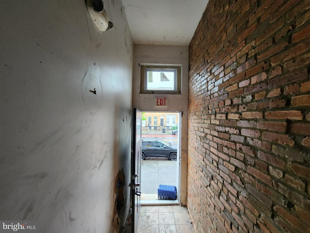 hall with brick wall