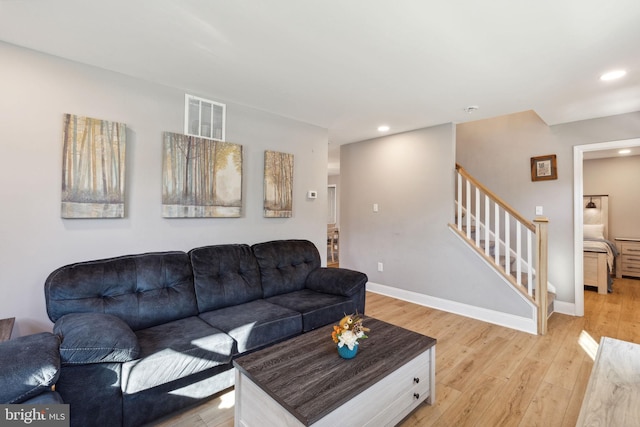 living room with light hardwood / wood-style flooring