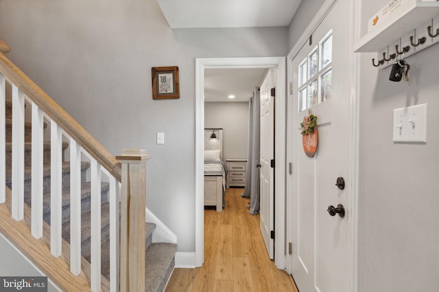 hallway with light hardwood / wood-style flooring