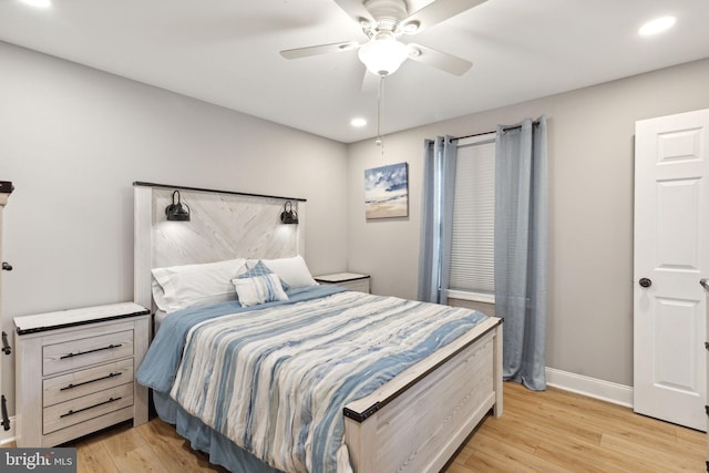 bedroom with light wood-type flooring and ceiling fan