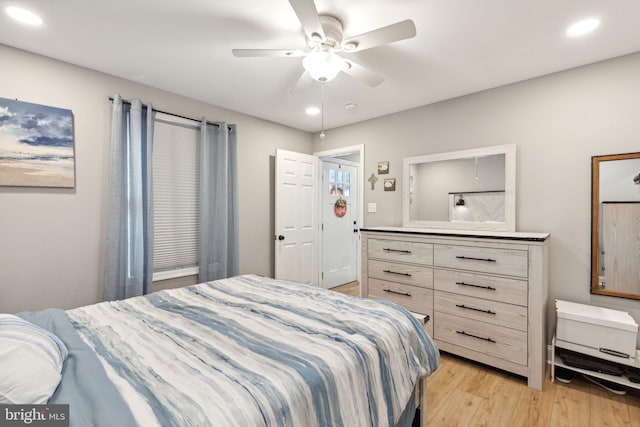 bedroom featuring light hardwood / wood-style flooring and ceiling fan