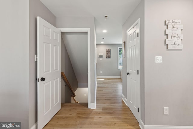 hall with light wood-type flooring