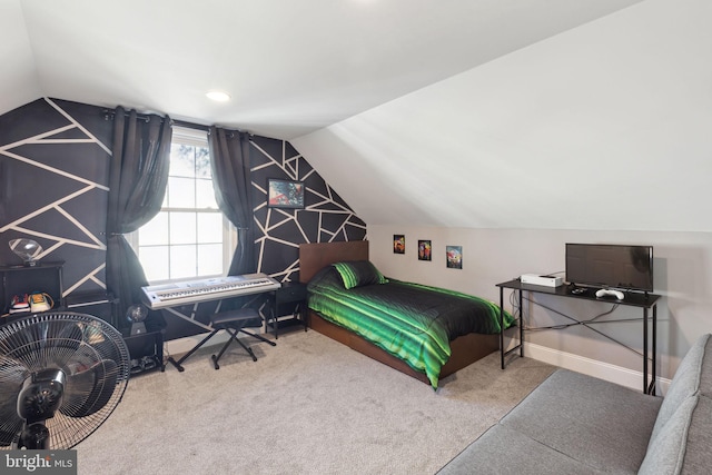 carpeted bedroom with lofted ceiling