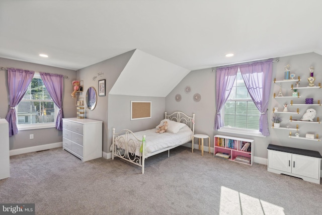 bedroom with light carpet and vaulted ceiling