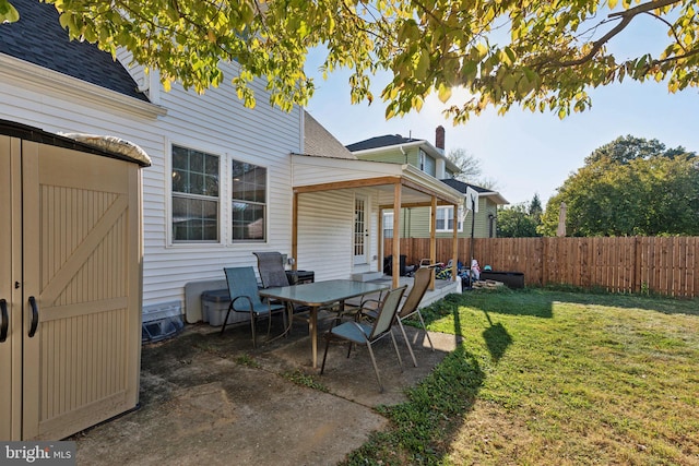 view of patio with a storage unit