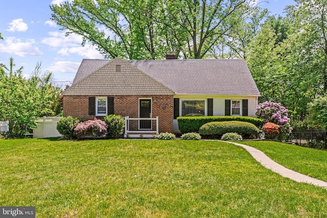 view of front of house featuring a chimney and brick siding