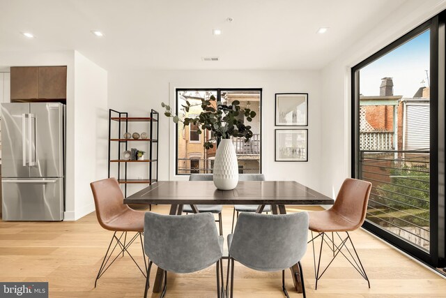 dining room with light hardwood / wood-style floors