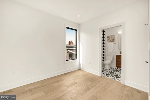 spare room featuring light hardwood / wood-style floors