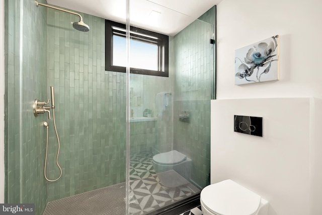 bathroom with toilet and an enclosed shower