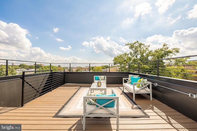 wooden deck featuring an outdoor living space