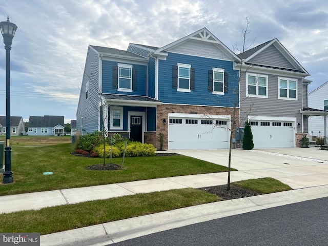 view of front of property featuring a front yard and a garage