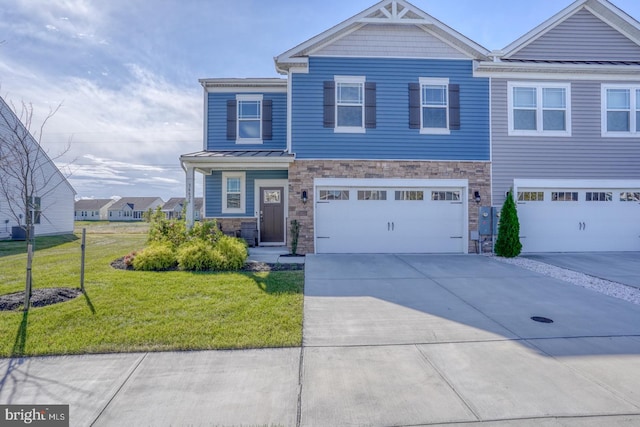 view of front of property featuring a front yard and a garage