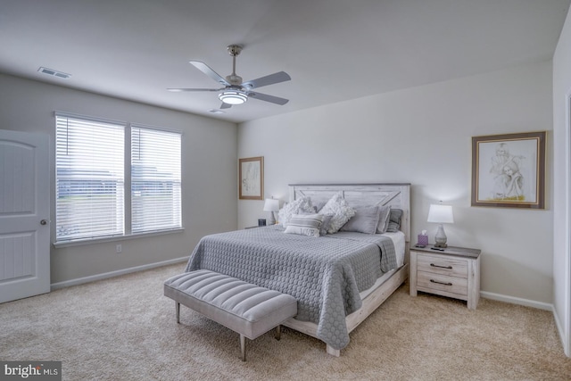 bedroom featuring ceiling fan and light colored carpet