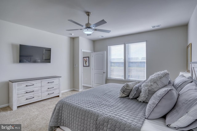 bedroom featuring ceiling fan and light colored carpet